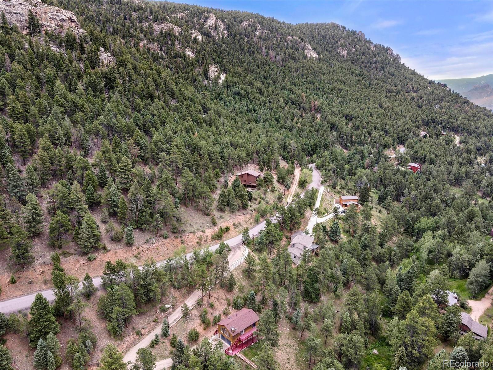 13519 Elsie Road Conifer, CO 80433 - Photo 27 of 31 an aerial view of house with yard and mountain view
