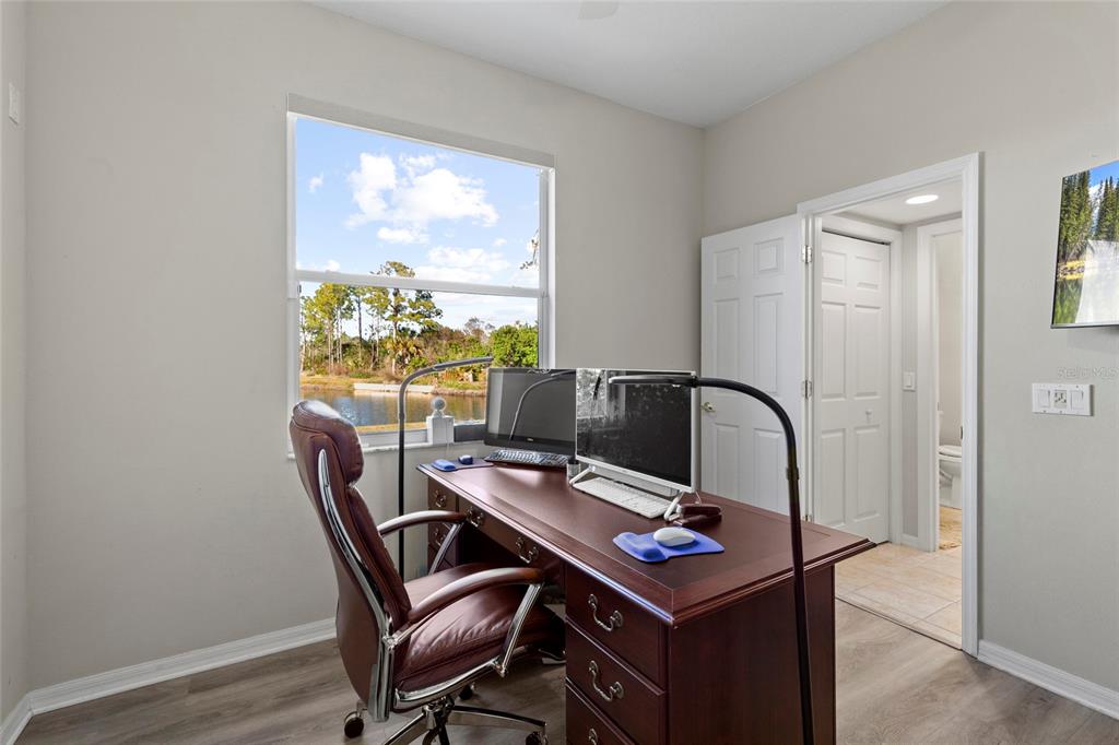 11011 Water Lily Way Lakewood Ranch, FL 34202 - Photo 14 of 24 a view of a workspace with furniture and a window