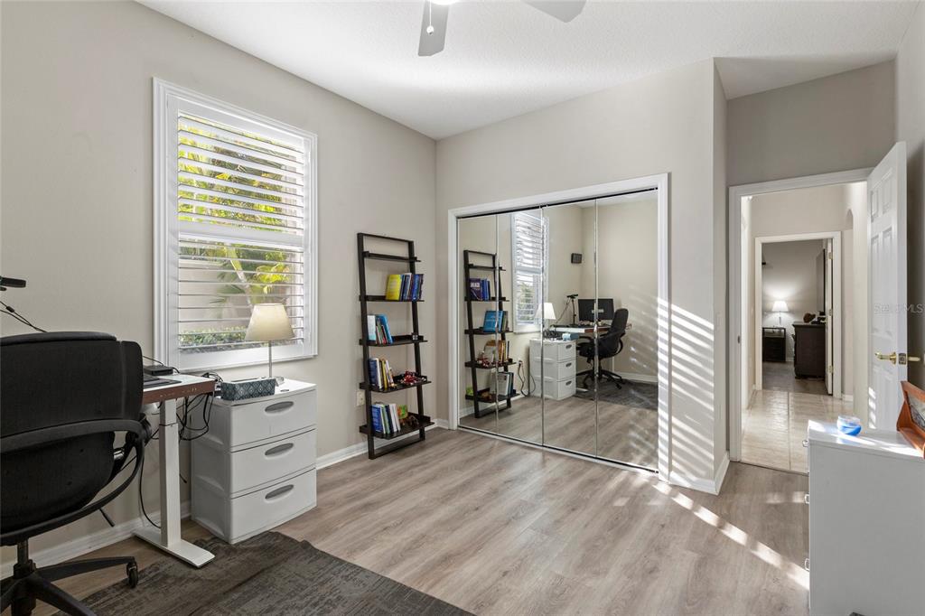 11011 Water Lily Way Lakewood Ranch, FL 34202 - Photo 15 of 24 a view of a workspace with furniture and a window