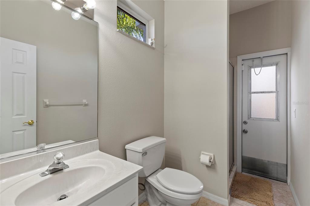 11011 Water Lily Way Lakewood Ranch, FL 34202 - Photo 16 of 24 a bathroom with a sink mirror vanity and toilet