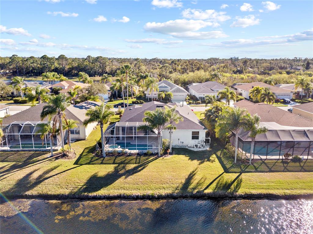11011 Water Lily Way Lakewood Ranch, FL 34202 - Photo 20 of 24 a view of a swimming pool with a lake view