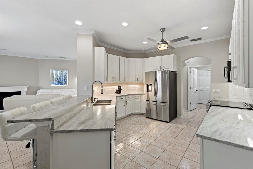 11011 Water Lily Way Lakewood Ranch, FL 34202 - Photo 3 of 24 a kitchen with refrigerator and cabinets
