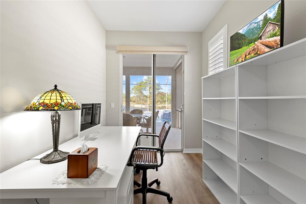 11011 Water Lily Way Lakewood Ranch, FL 34202 - Photo 9 of 24 a dining room with furniture and wooden floor