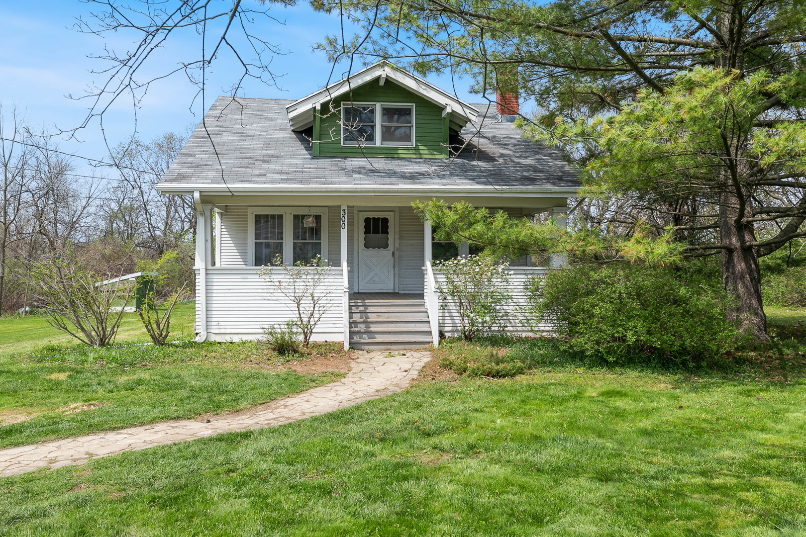 300 Geneva Road Glen Ellyn, IL 60137 - Photo 2 of 3 a front view of a house with a yard