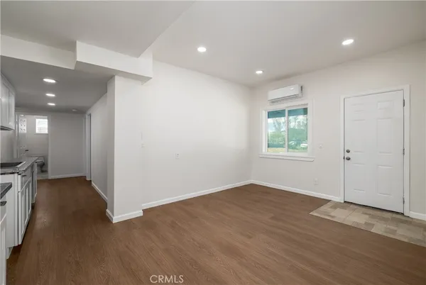 a kitchen with stainless steel appliances granite countertop a sink stove and microwave