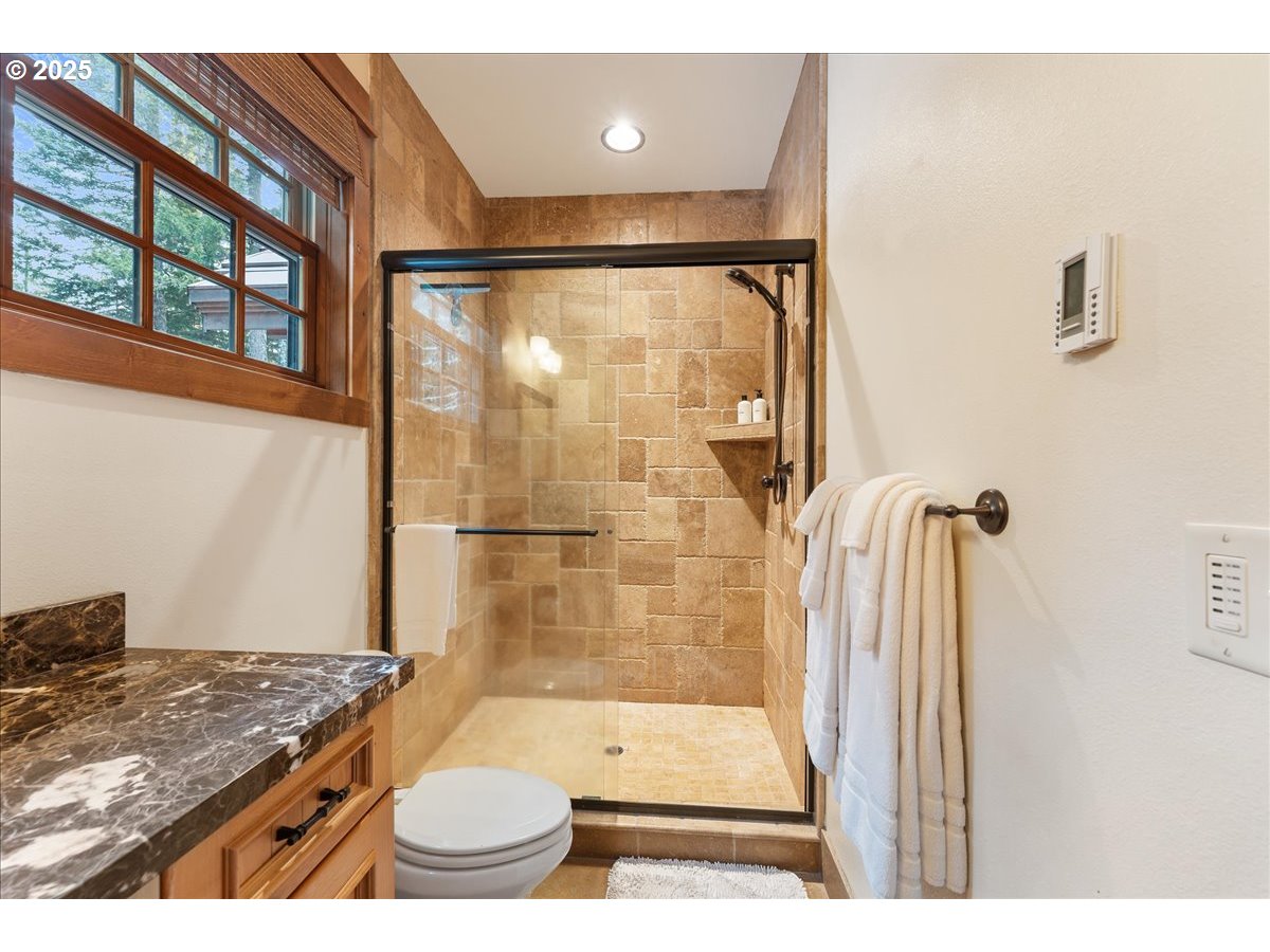 30930 Tyrolean Lane Government Camp, OR 97028 - Photo 22 of 42 a bathroom with a granite countertop sink toilet and shower