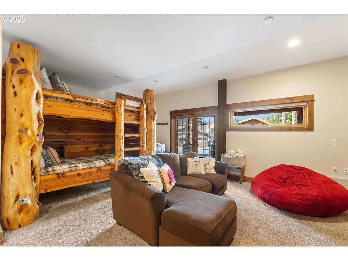 30930 Tyrolean Lane Government Camp, OR 97028 - Photo 26 of 42 a living room with furniture and a flat screen tv