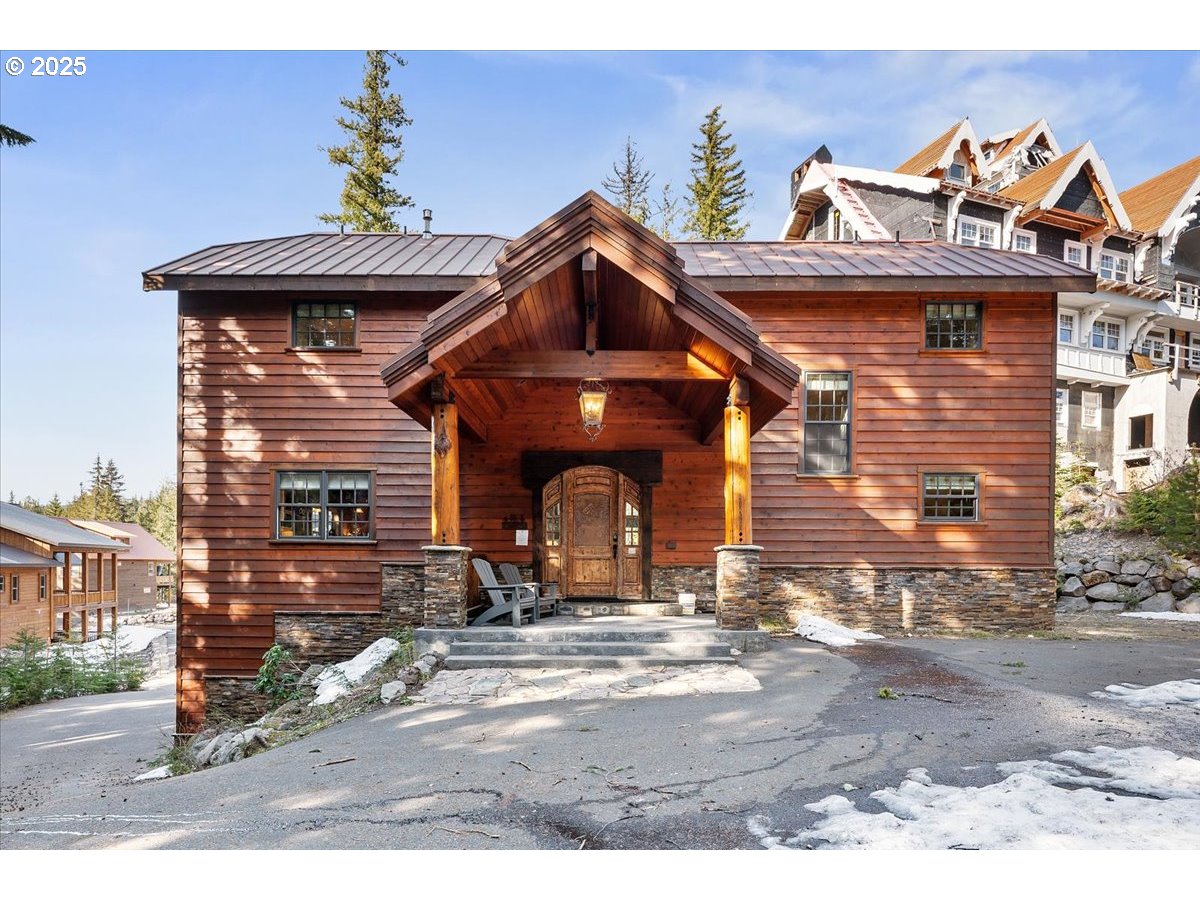 30930 Tyrolean Lane Government Camp, OR 97028 - Photo 5 of 42 a front view of a house with a yard