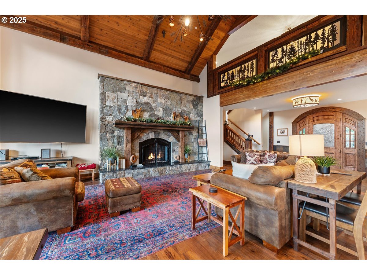 30930 Tyrolean Lane Government Camp, OR 97028 - Photo 8 of 42 a living room with furniture a fireplace and a flat screen tv