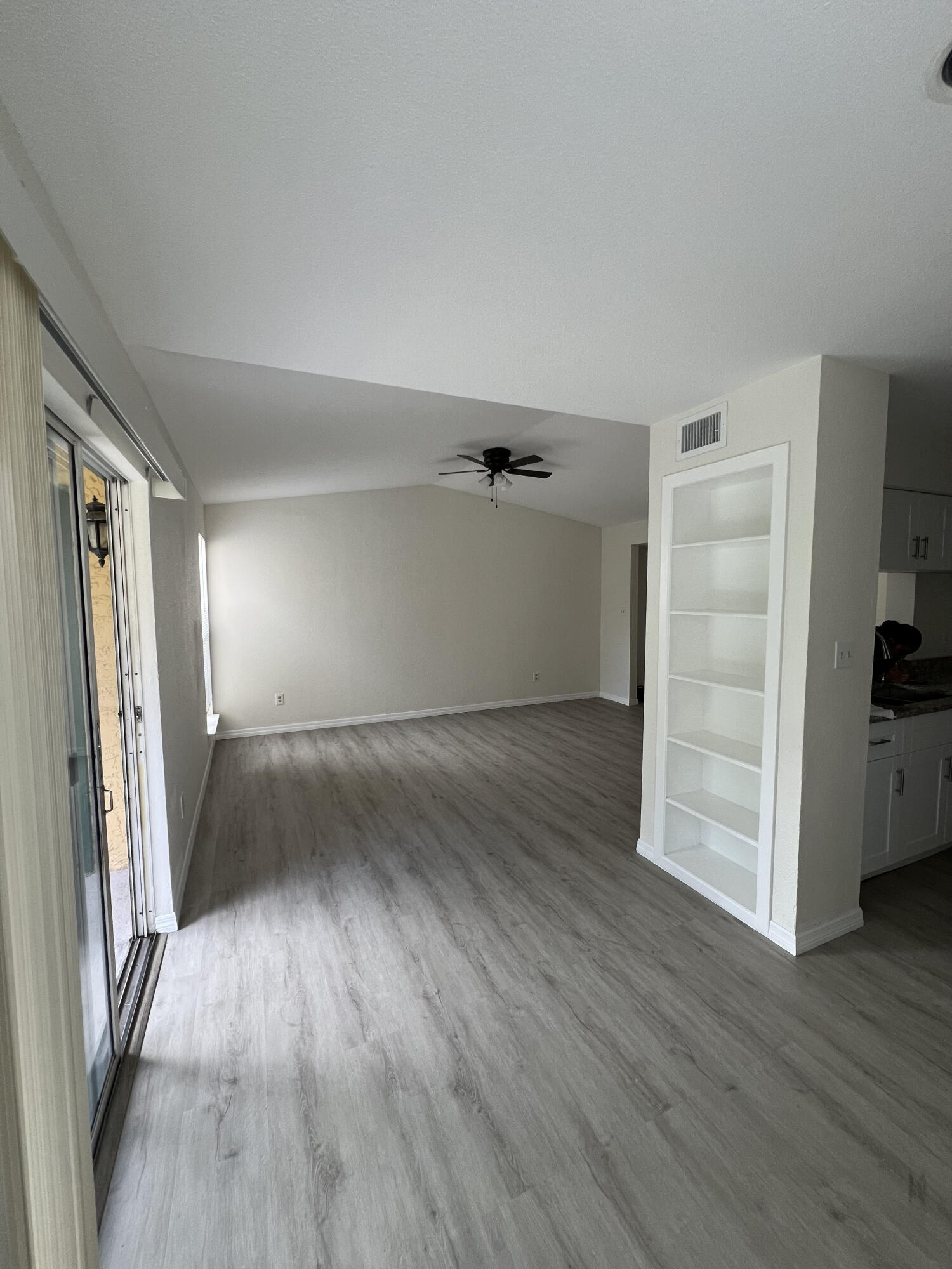 899 Riverside Drive, Unit 620 Coral Springs, FL 33071 - Photo 33 of 46 an empty room with wooden floor closet and windows