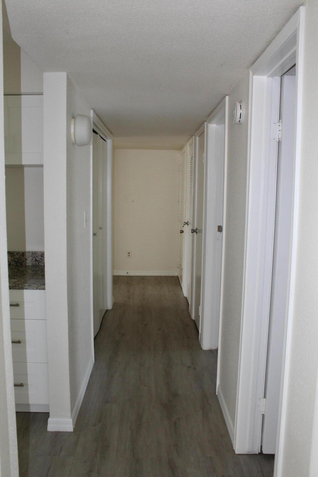 899 Riverside Drive, Unit 620 Coral Springs, FL 33071 - Photo 40 of 46 a view of a hallway with closet area