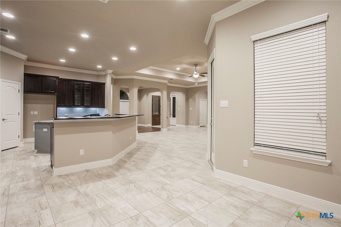 549 Wills Point Way Belton, TX 76513 - Photo 6 of 31 a living room with stainless steel appliances kitchen island granite countertop a refrigerator and a sink