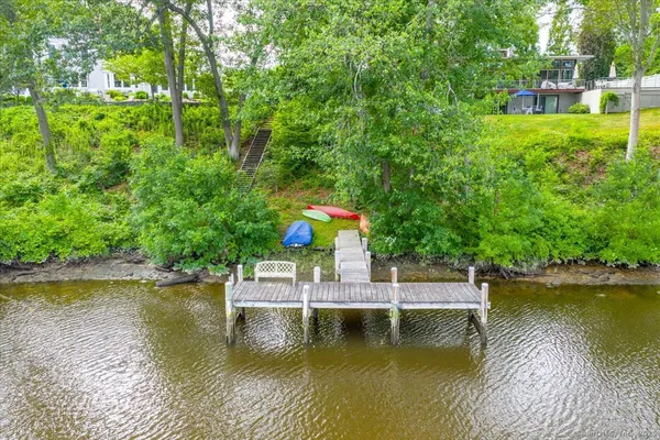 a view of house with swimming pool and outdoor space