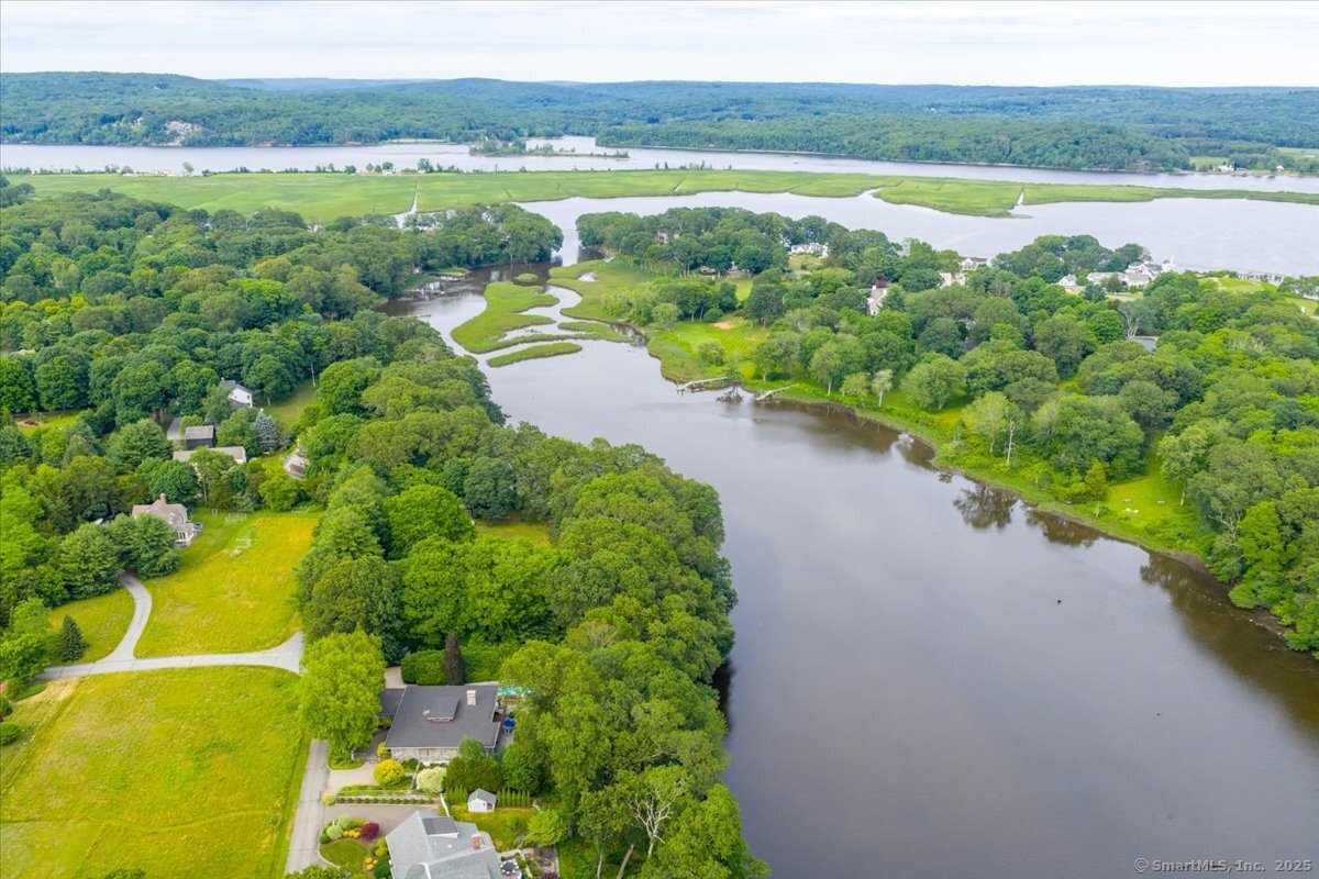 41 B River Road Essex, CT 06426 - Photo 7 of 16 a view of a lake with a mountain