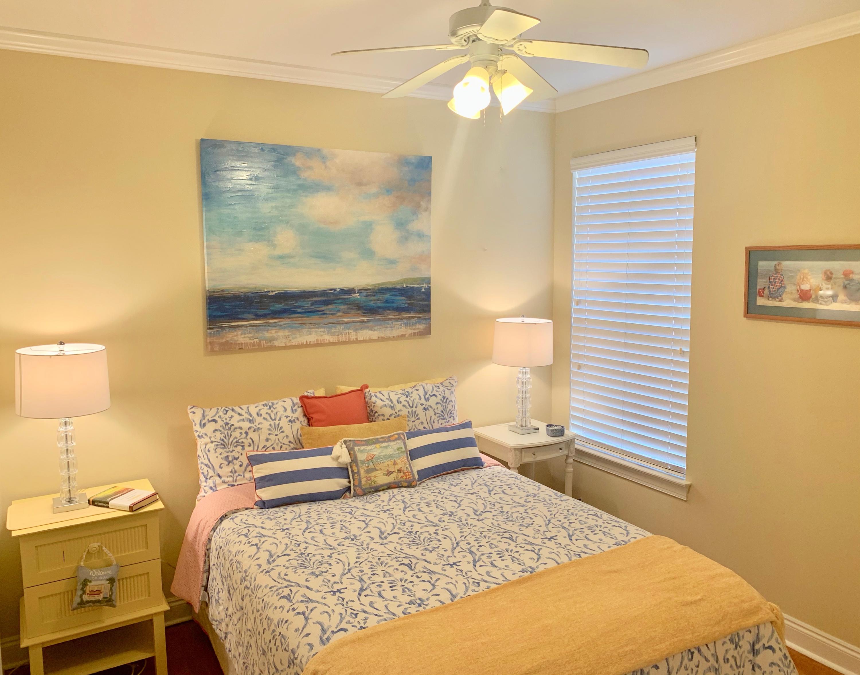 4213 Jade Loop Destin, FL 32541 - Photo 24 of 46 a bedroom with a bed and wooden floor