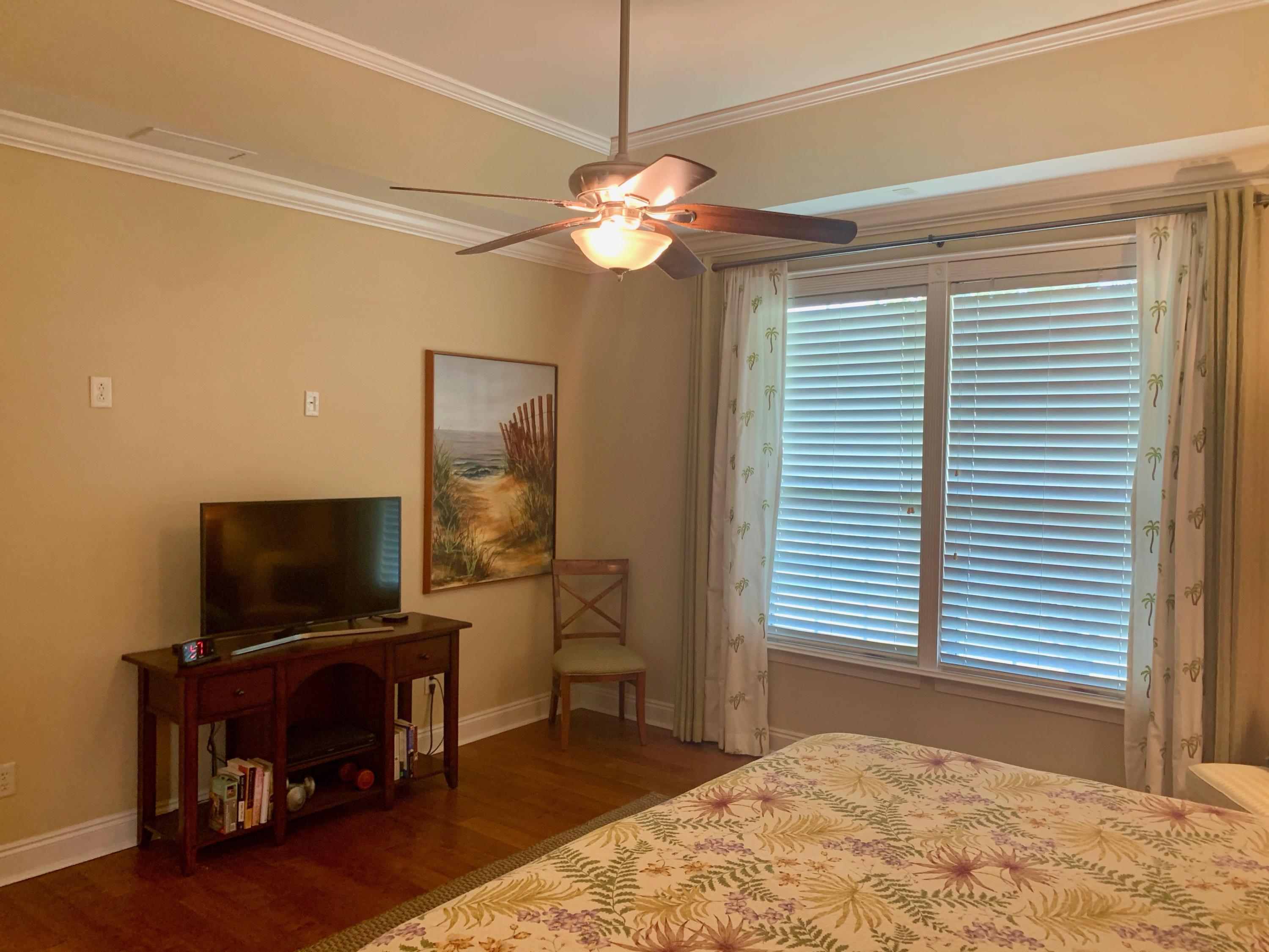 4213 Jade Loop Destin, FL 32541 - Photo 31 of 46 a bedroom with furniture and a flat screen tv