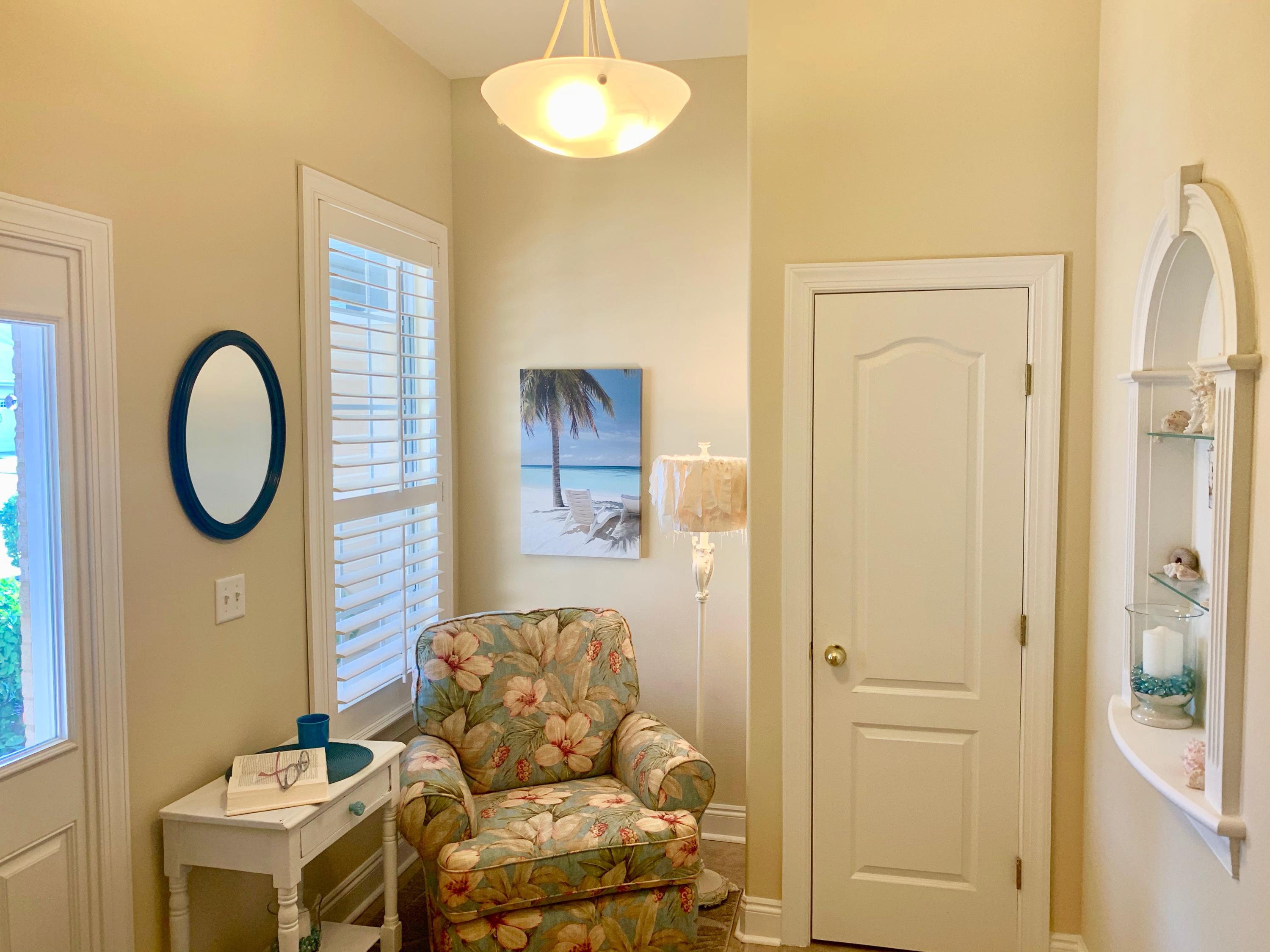 4213 Jade Loop Destin, FL 32541 - Photo 6 of 46 a living room with furniture a mirror and a window