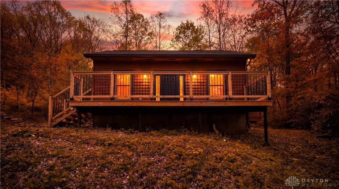 10584 New Biddinger Road Harrison, OH 45030 - Photo 2 of 61 This secluded cabin retreat offers a tranquil escape amidst a vibrant, wooded landscape.