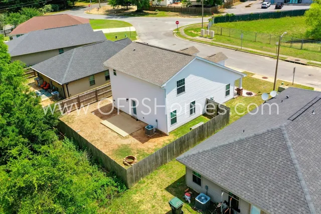 an aerial view of a house with a swimming pool