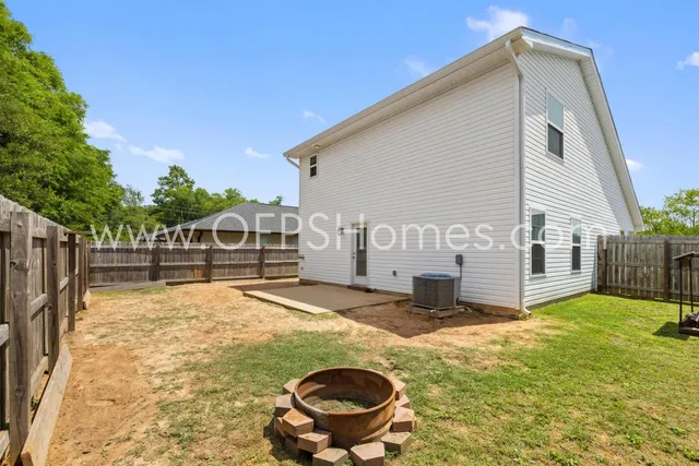 a view of a backyard of the house