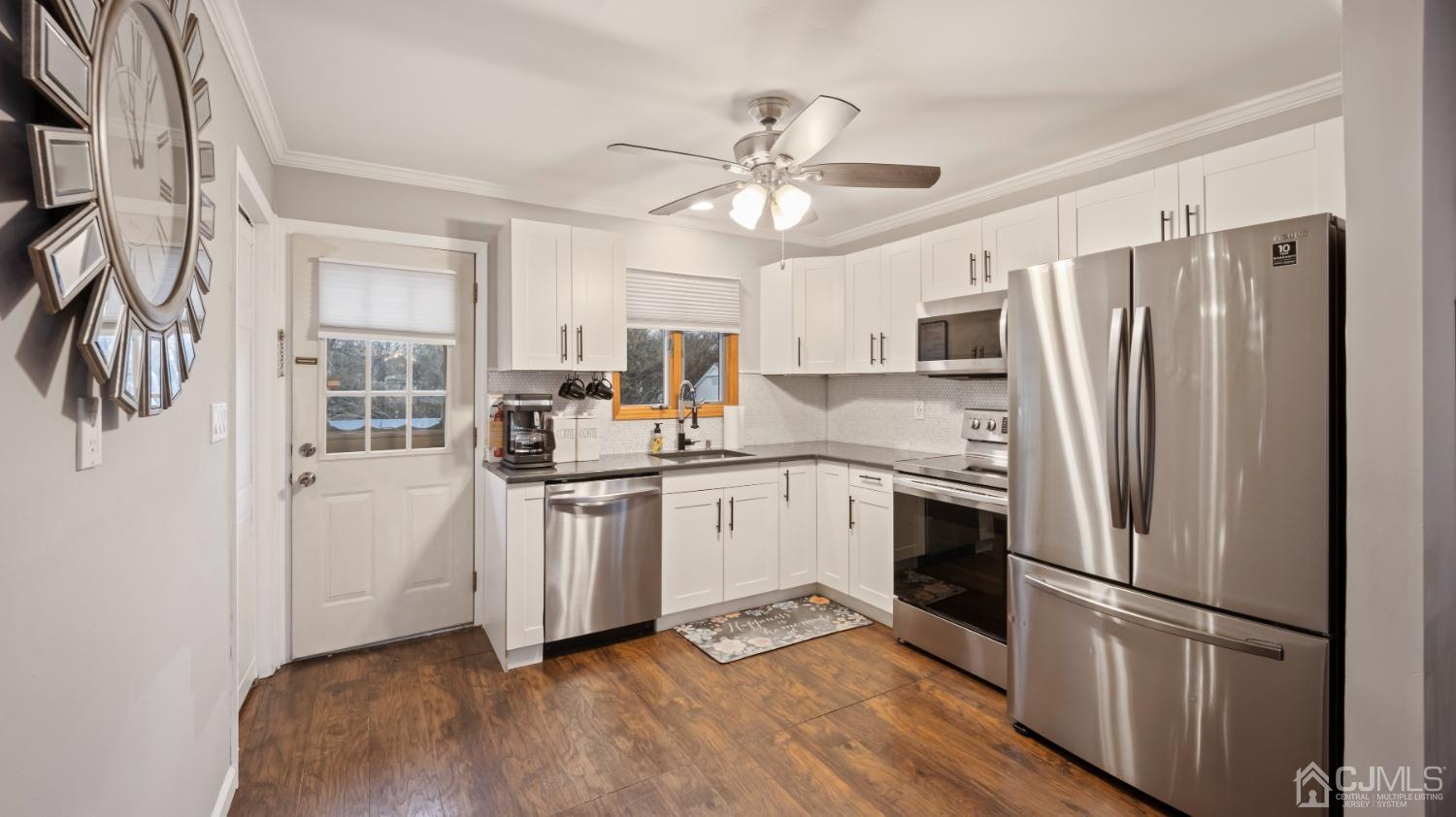27 Melville Road Edison, NJ 08817 - Photo 11 of 14 a kitchen with stainless steel appliances a refrigerator sink and microwave