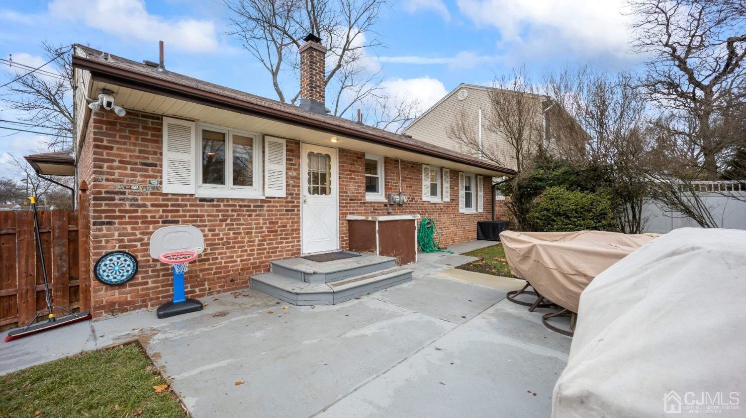 27 Melville Road Edison, NJ 08817 - Photo 2 of 14 a backyard of a house with outdoor seating