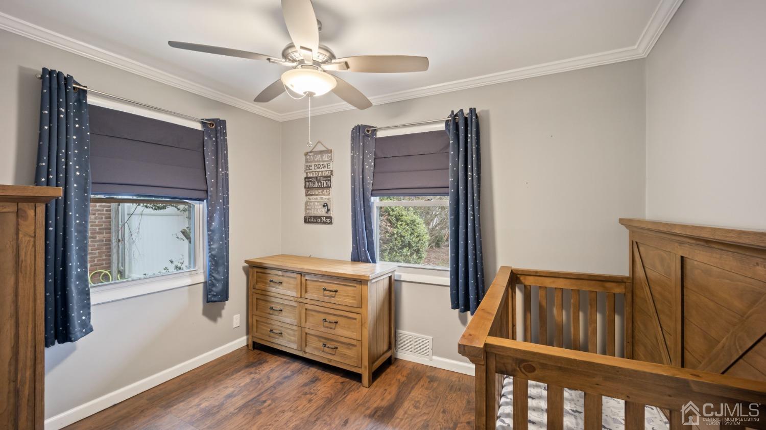 27 Melville Road Edison, NJ 08817 - Photo 5 of 14 a view of front door and bedroom with wooden floor