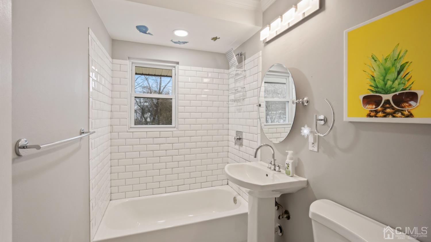 27 Melville Road Edison, NJ 08817 - Photo 6 of 14 a bathroom with a sink a toilet and shower