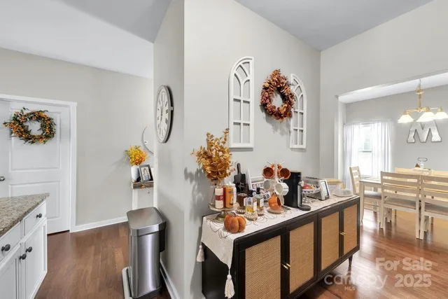 a kitchen with sink and view of living room