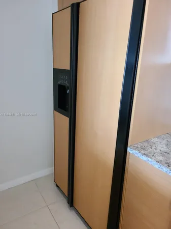 a kitchen with granite countertop a sink and a stove