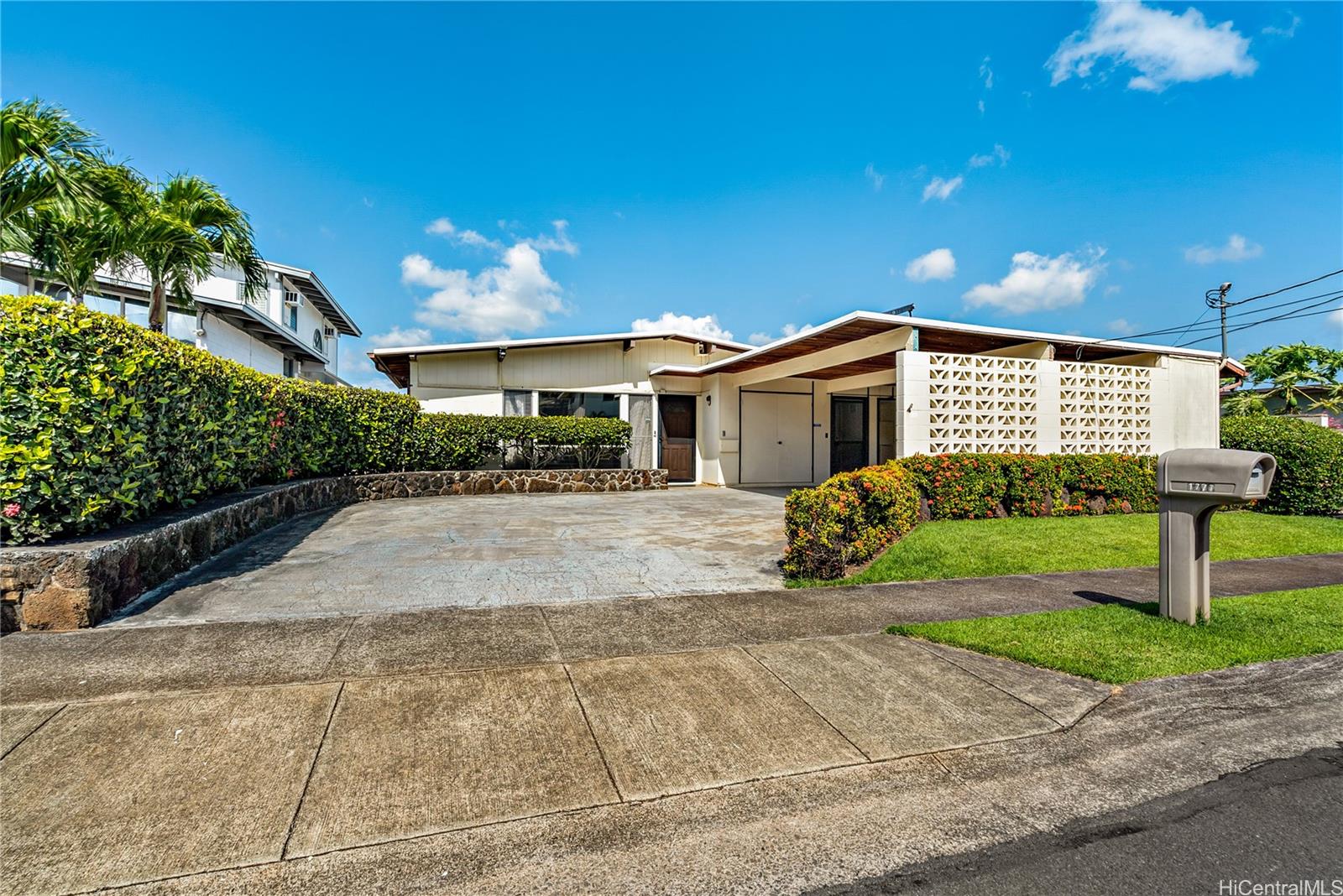 1777 Piikea Street Honolulu, HI 96818 - Photo 1 of 1 a front view of a house with a yard and potted plants