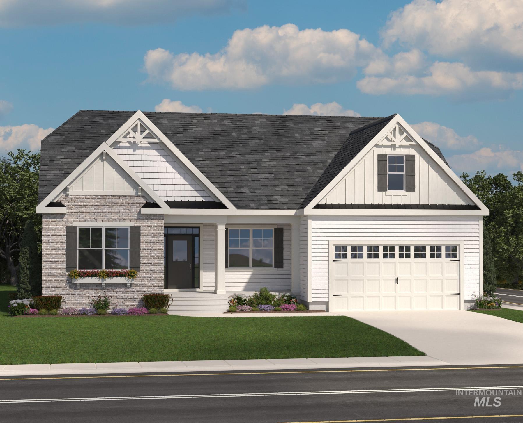 9800 West Delta Brook Street Star, ID 83669 - Photo 2 of 2 View of front of home with board and batten siding, a front lawn, a garage, driveway, and a shingled roof