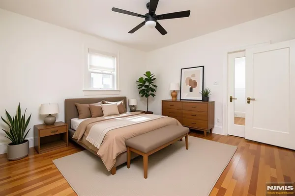 a spacious bedroom with a bed and a dresser
