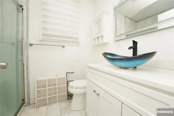 a bathroom with a toilet and a sink