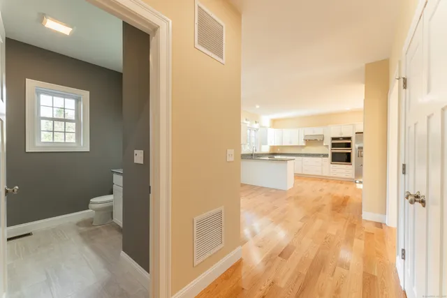 a view of a kitchen cabinets and wooden floor
