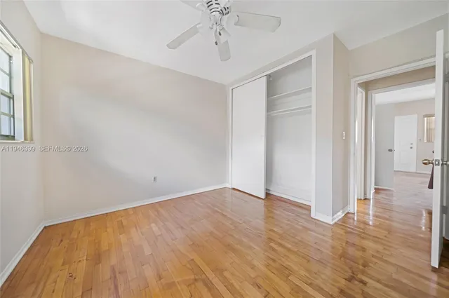 a view of an empty room with a fan