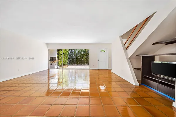 a view of an empty room with a fireplace