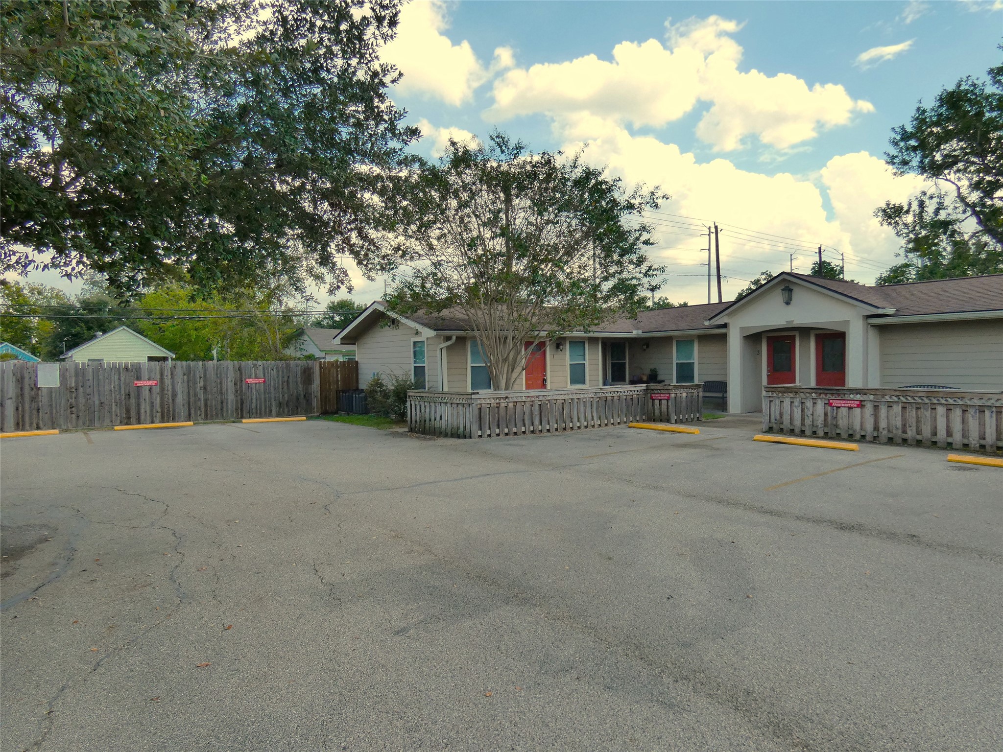507 Houston Street, Unit 2 Rosenberg, TX 77471 - Photo 12 of 20 a front view of a house with a garden