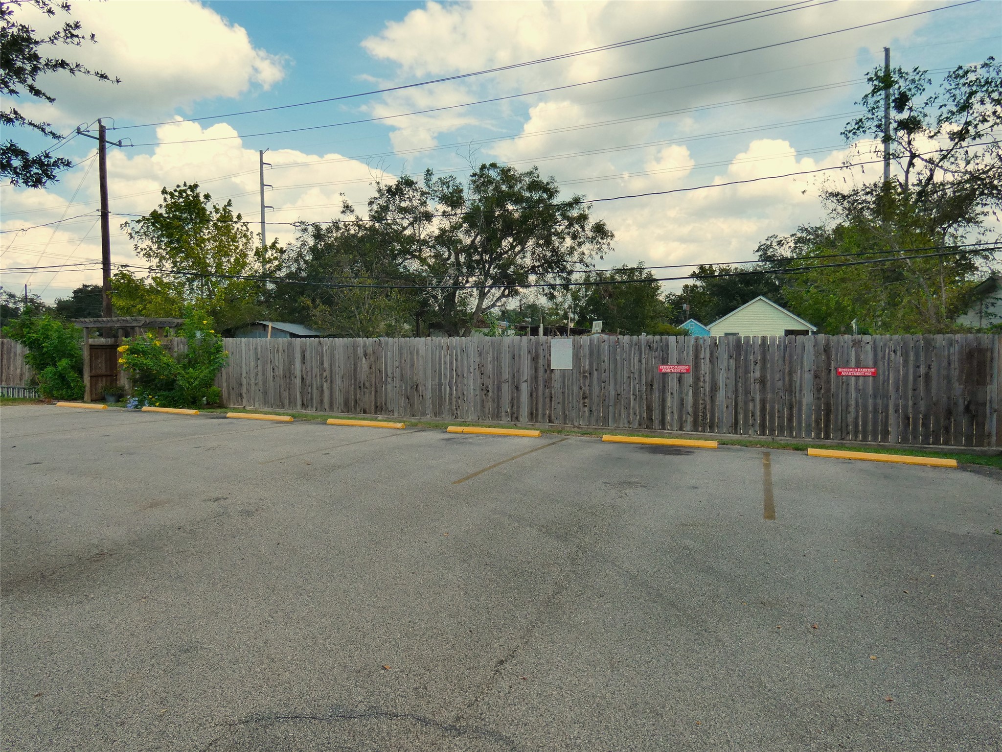 507 Houston Street, Unit 2 Rosenberg, TX 77471 - Photo 14 of 20 a view of a backyard with wooden fence