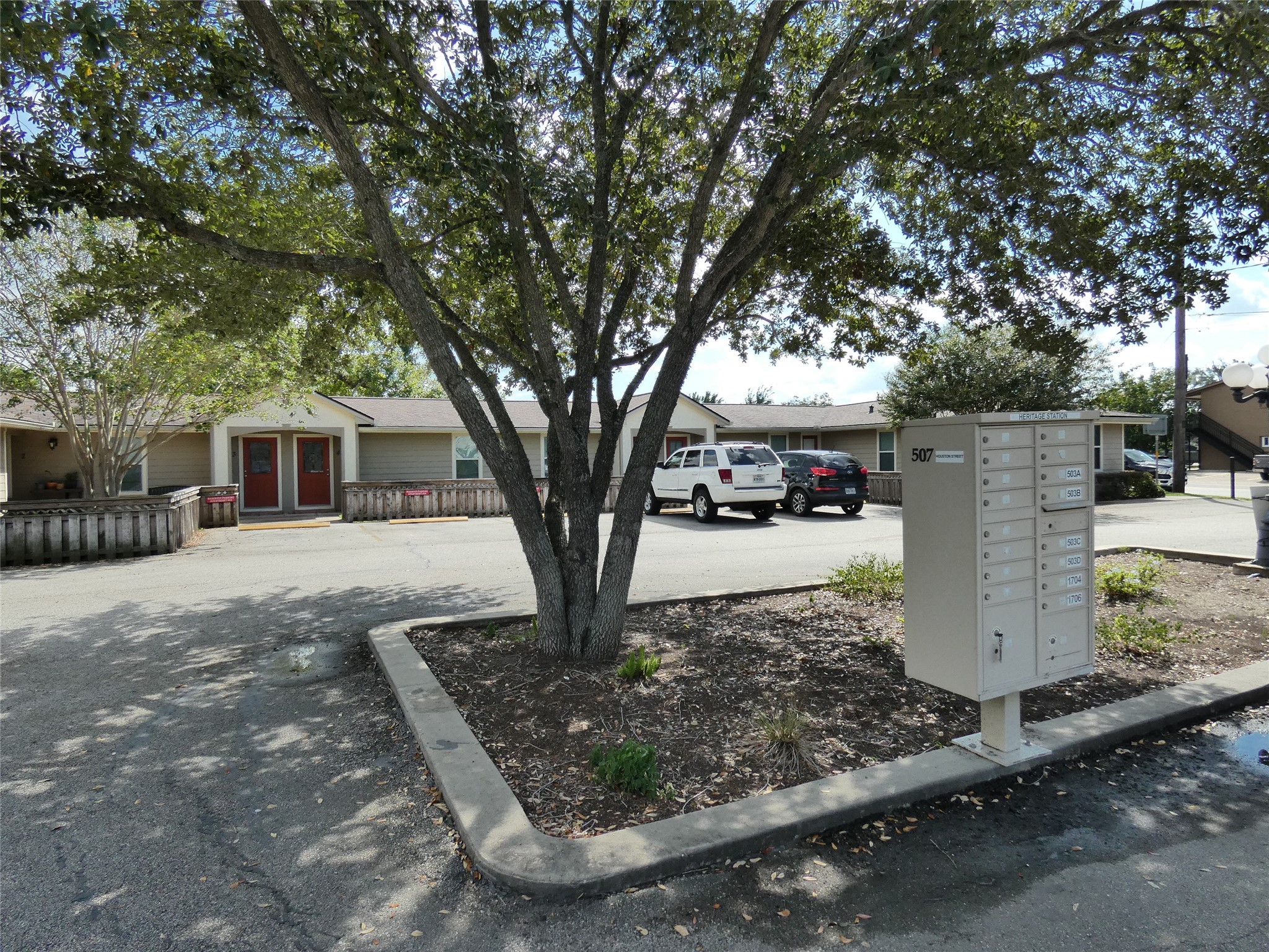 507 Houston Street, Unit 2 Rosenberg, TX 77471 - Photo 16 of 20 a view of a house with large tree