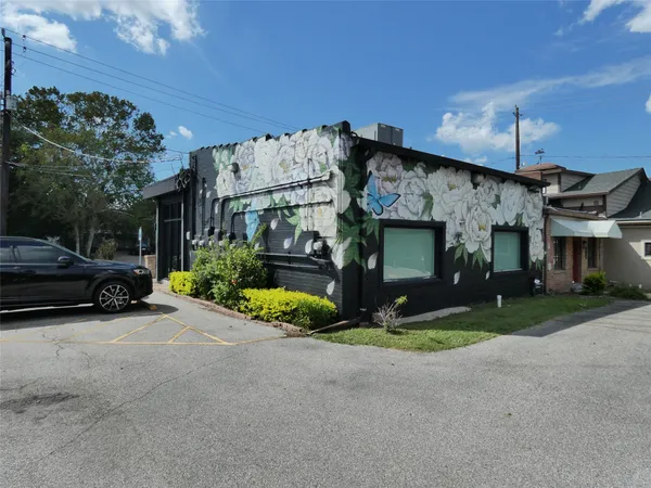a patio with yard glass top table and chairs