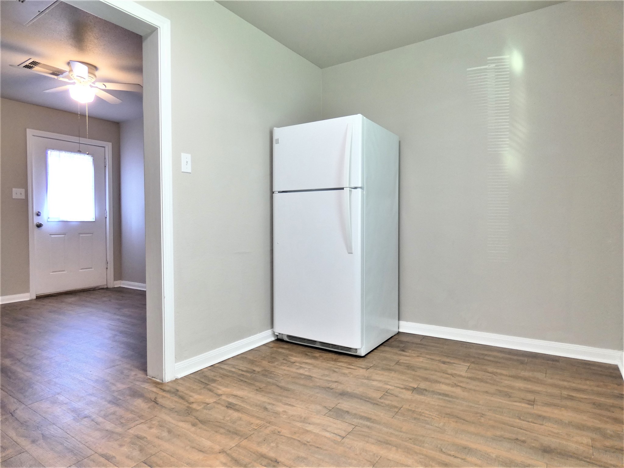 507 Houston Street, Unit 2 Rosenberg, TX 77471 - Photo 5 of 20 a view of empty room with wooden floor