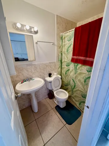 a bathroom with a toilet and a sink