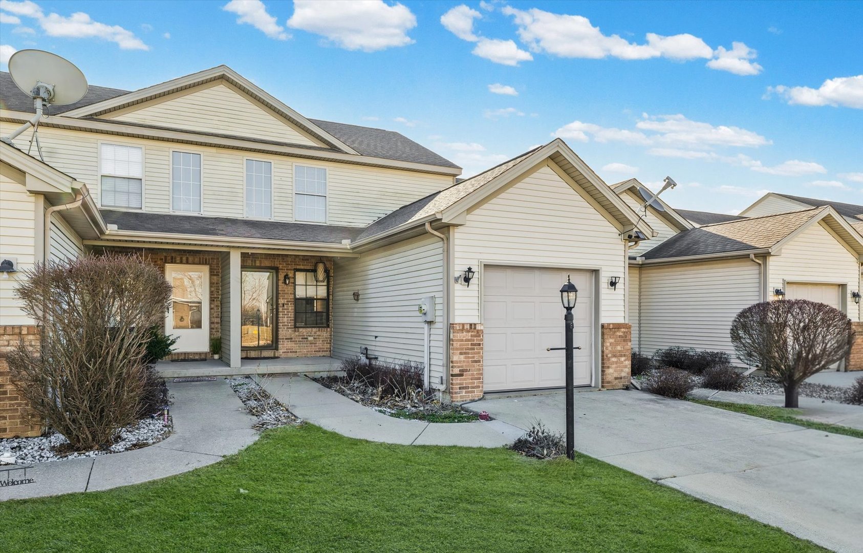 3725 Boulder Ridge Drive, Unit E Champaign, IL 61822 - Photo 1 of 30 a view of a house with backyard and a garden