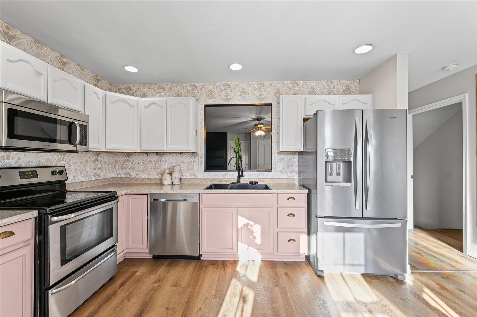 3725 Boulder Ridge Drive, Unit E Champaign, IL 61822 - Photo 11 of 30 a kitchen with stainless steel appliances a stove a sink and a refrigerator