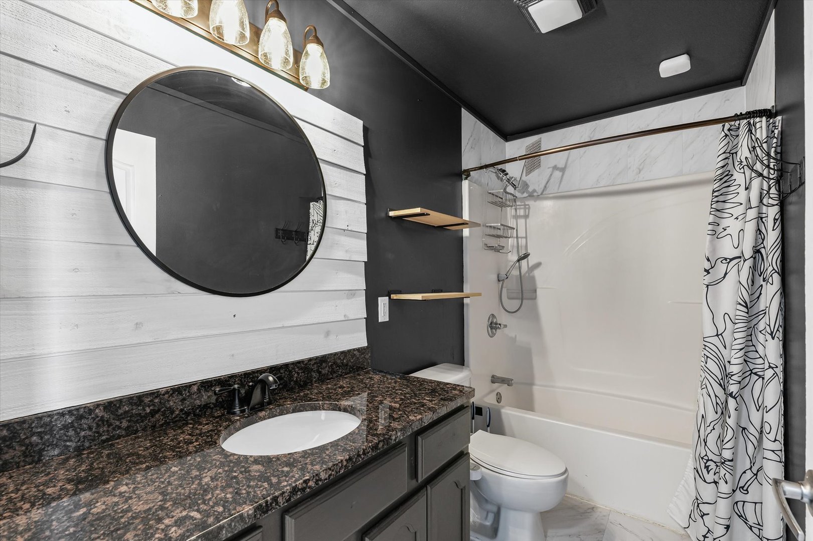 3725 Boulder Ridge Drive, Unit E Champaign, IL 61822 - Photo 18 of 30 a bathroom with a granite countertop sink and a mirror