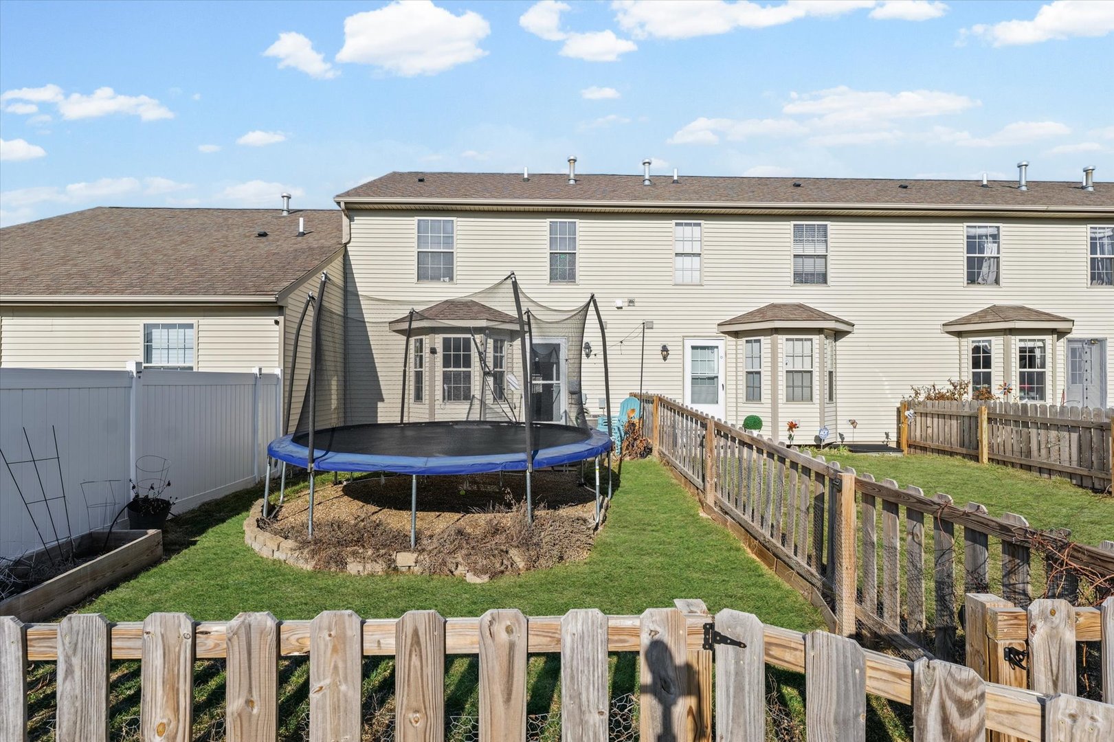 3725 Boulder Ridge Drive, Unit E Champaign, IL 61822 - Photo 28 of 30 a front view of a house with a yard