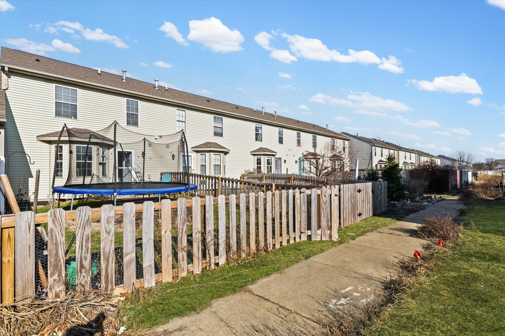 3725 Boulder Ridge Drive, Unit E Champaign, IL 61822 - Photo 29 of 30 a view of a house with backyard and porch