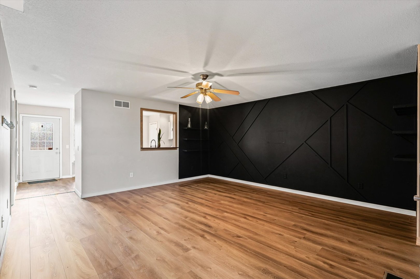 3725 Boulder Ridge Drive, Unit E Champaign, IL 61822 - Photo 5 of 30 a view of an empty room with wooden floor