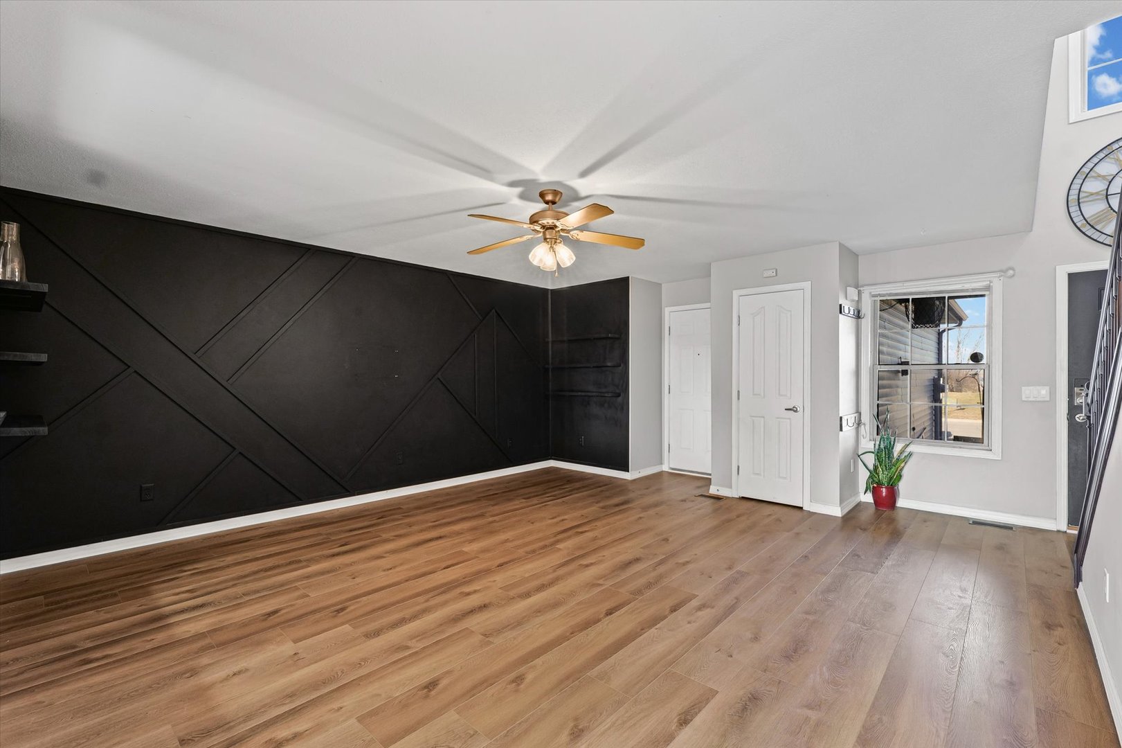 3725 Boulder Ridge Drive, Unit E Champaign, IL 61822 - Photo 7 of 30 a view of an empty room with wooden floor